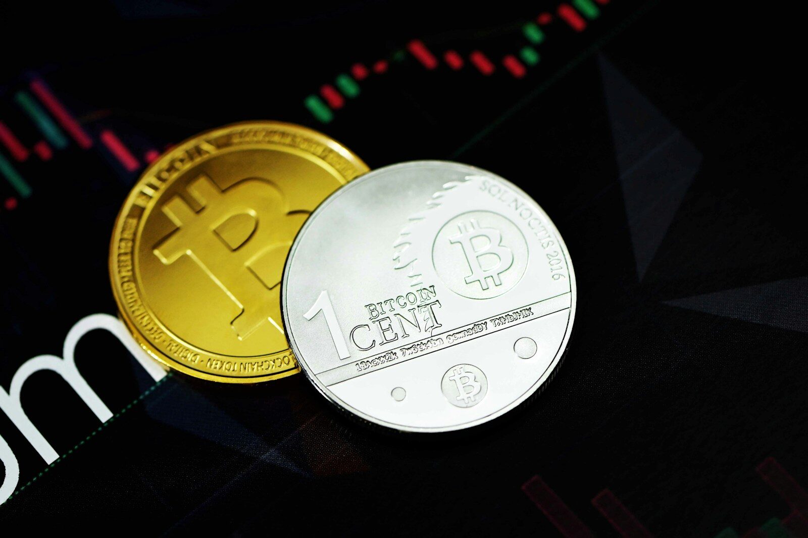 gold round coin on black surface